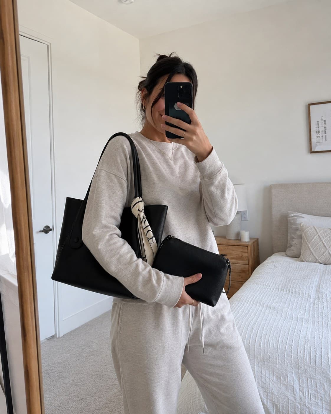 The Everyday Tote in Noir, styled with a casual outfit